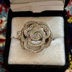 Sterling silver cocktail ring with swirl design and tiny cz stones set in design